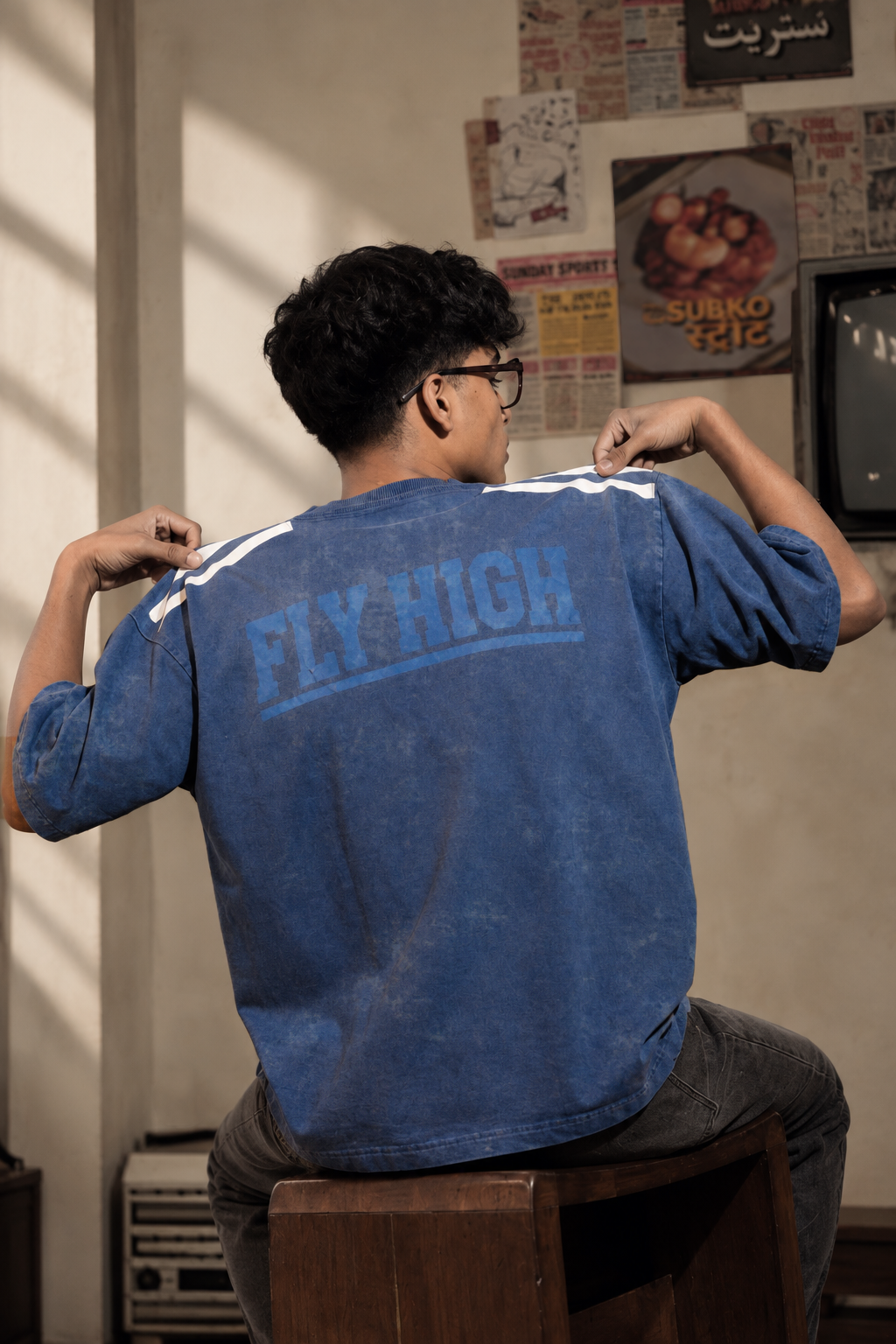 Model wearing the Blue Lions Retro Tee, back view