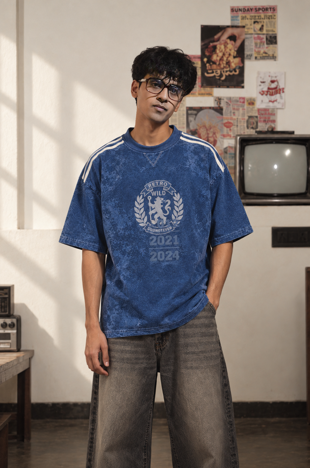 Model wearing the Blue Lions Retro Tee in deep blue