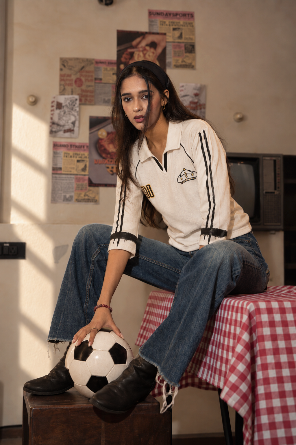 Model wearing the Crowned White Retro Baby Tee, front view
