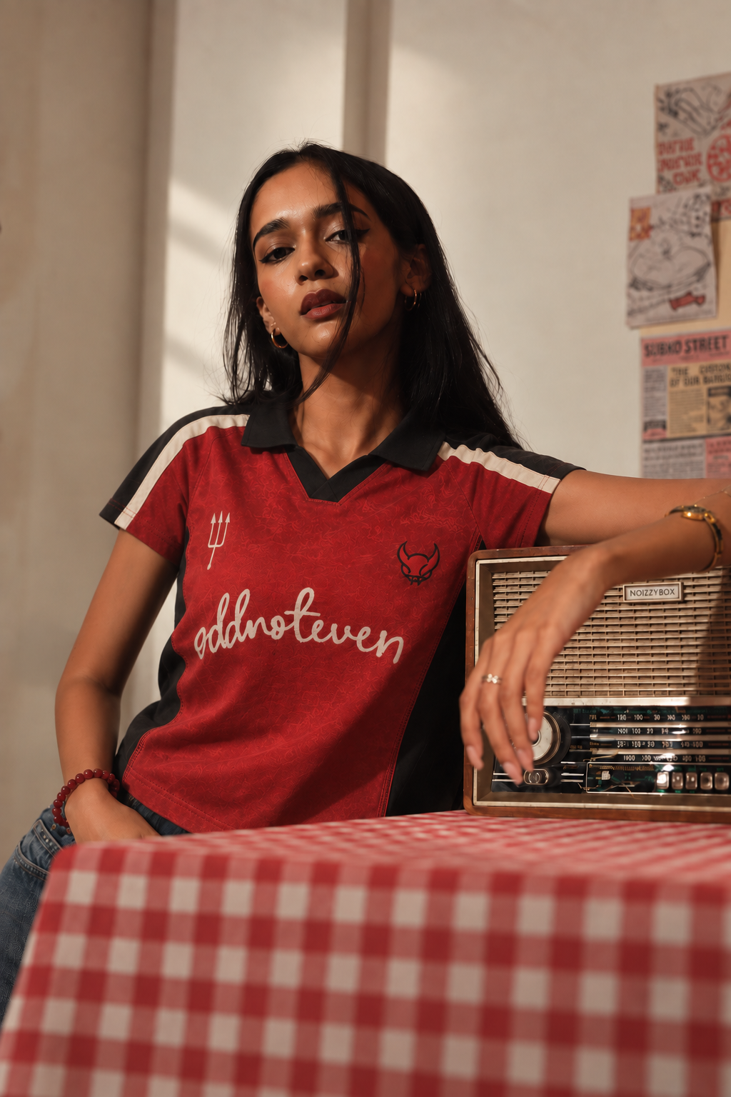 Model wearing the Red Devils Retro Baby Tee, front view